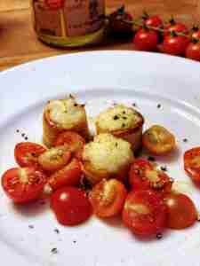 Mini puff pastry filled with cheese and toasted. Served with cherry tomatoes drizzled with olive oil, sea salt and pepper