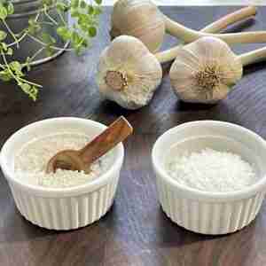 Sea salt and celtic salt with fresh garlic bulbs